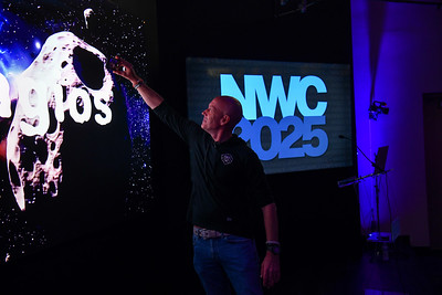 Ethan taking a selfie during the NWC 2025 keynote presentation.